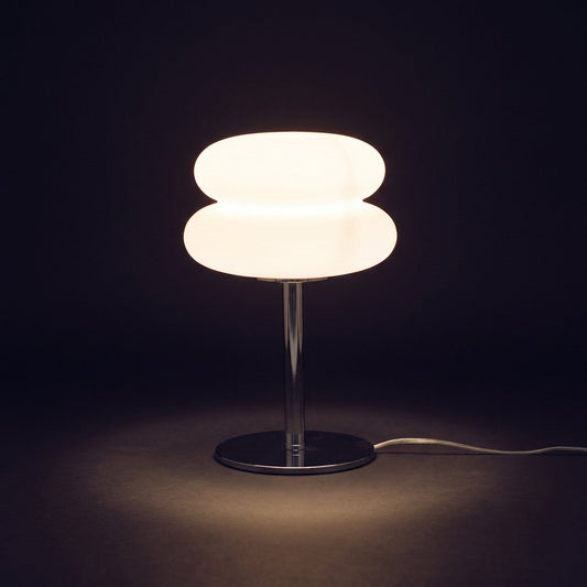 Mushroom lamp switched on, glowing warm white on a dark background