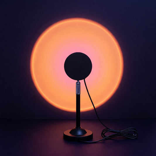 Sunset lamp from behind, throwing a round orange and pink glow on the wall